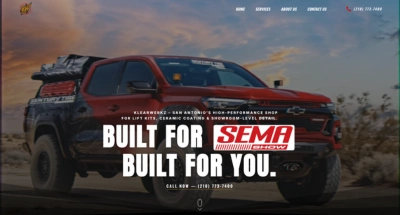 Lifted red truck parked in the desert, showcasing KlearWerkz custom auto builds and high-performance upgrades in San Antonio.