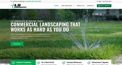 Lush green lawn with water sprinkler representing LS Landscapes commercial landscaping services in Central Texas.
